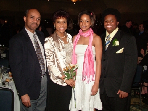 Shaune (2nd left), husband George (left) and children - Yvette and Daniel